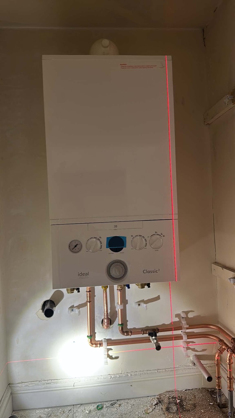 Boiler installation and neatly arranged copper pipework photographed by Jake